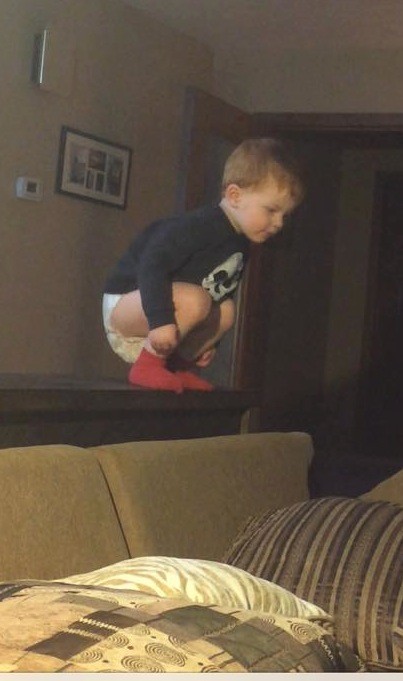 Kid jumping on bed